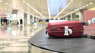 Luggage On Conveyor Belt At Airport