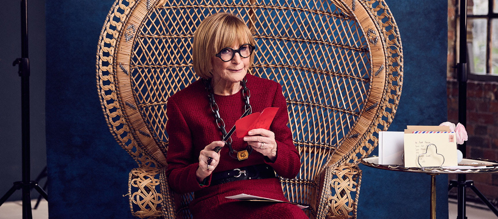 TV presenter Anne robinson sat in a wicker chair
