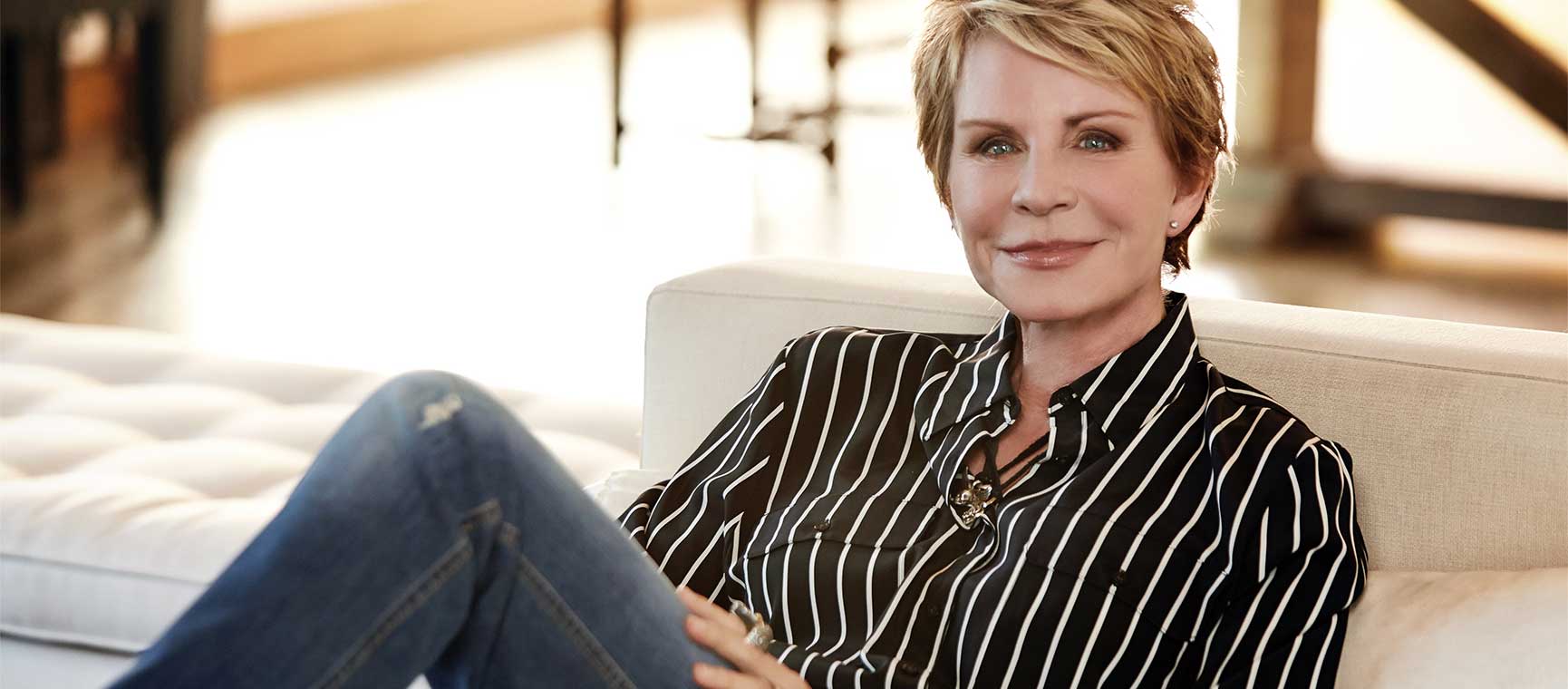 Author Patricia Cornwell relaxing on a sofa