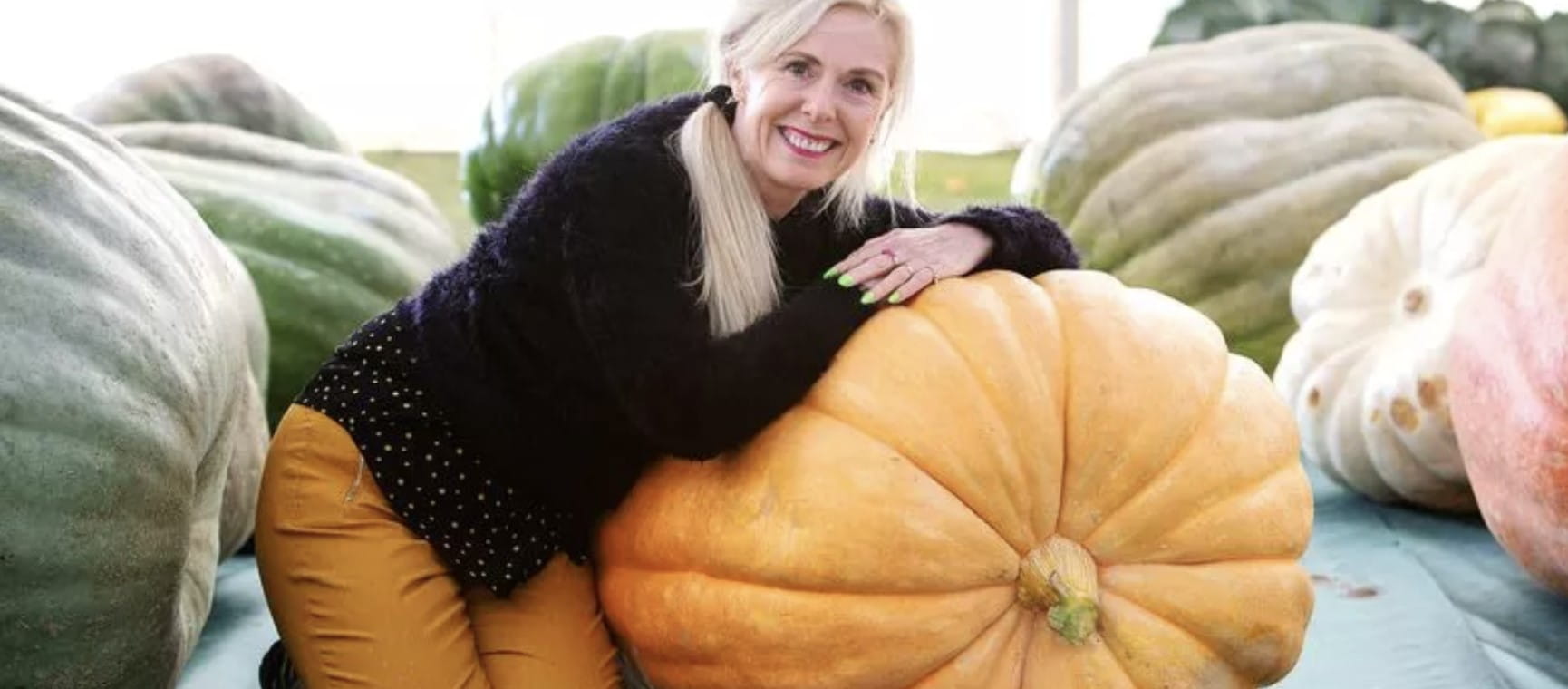 Michele  Thomas with one of her  giant pumpkins | Three Counties Showground
