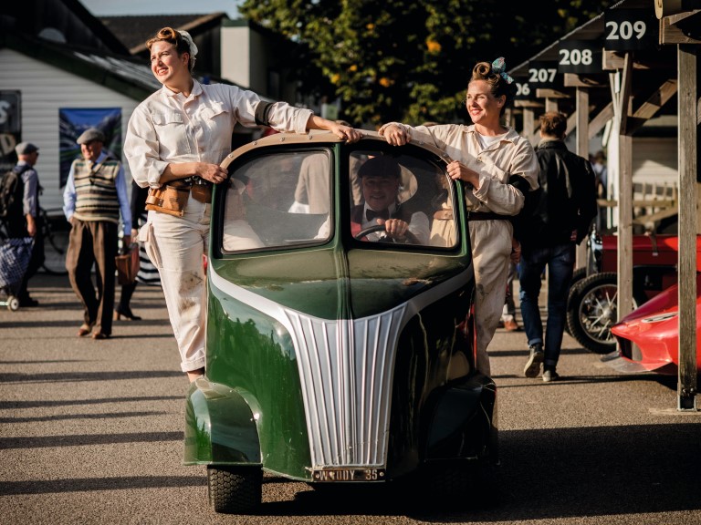 Two women in costume enjoy Goodwood