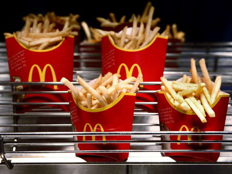 Four cartons of fries from McDonald's | Getty