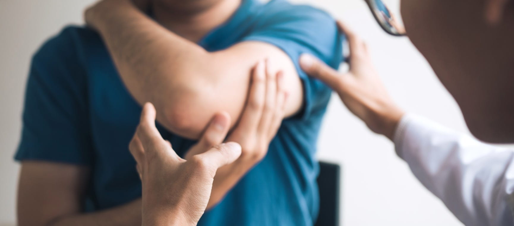 A man with fibromyalgia and achey muscles | Getty/wutwhanfoto