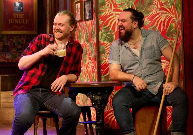 Choir of Man cast at the bar