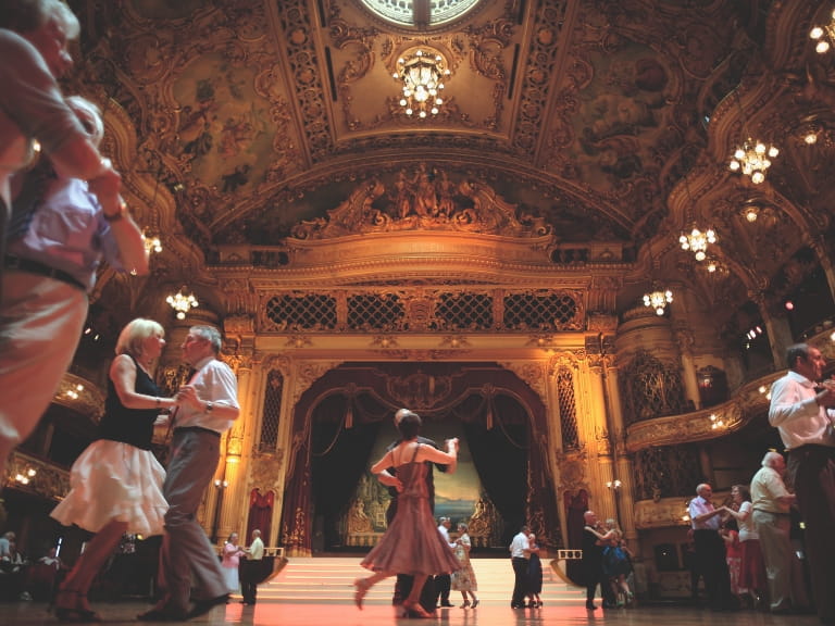 Couples dancing inside the gilded ballroom at Blackpool Tower