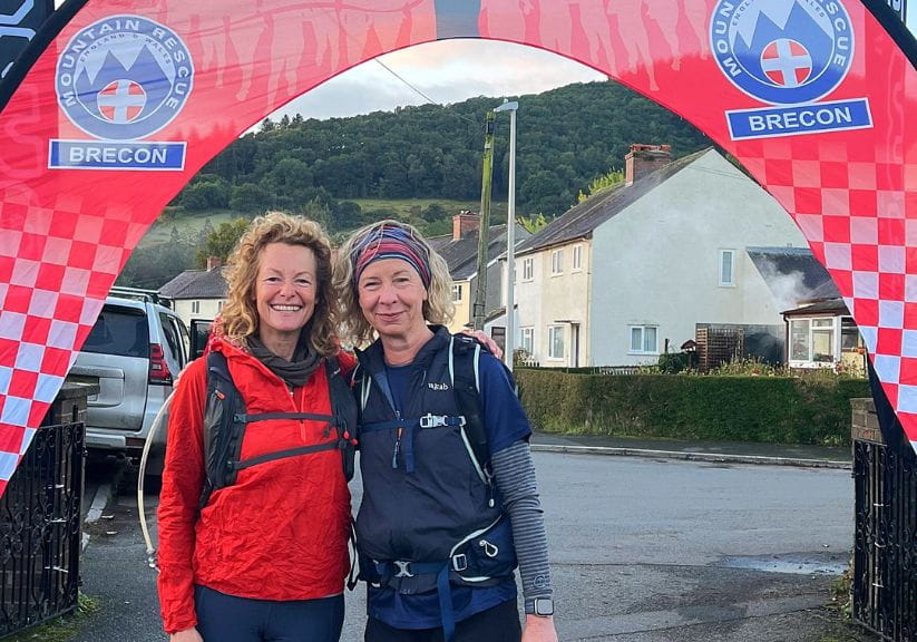 TV presenter Kate Humble with Saga magazine website editor Phillipa Cherryson underneath a red banner at the start of a challenge walk