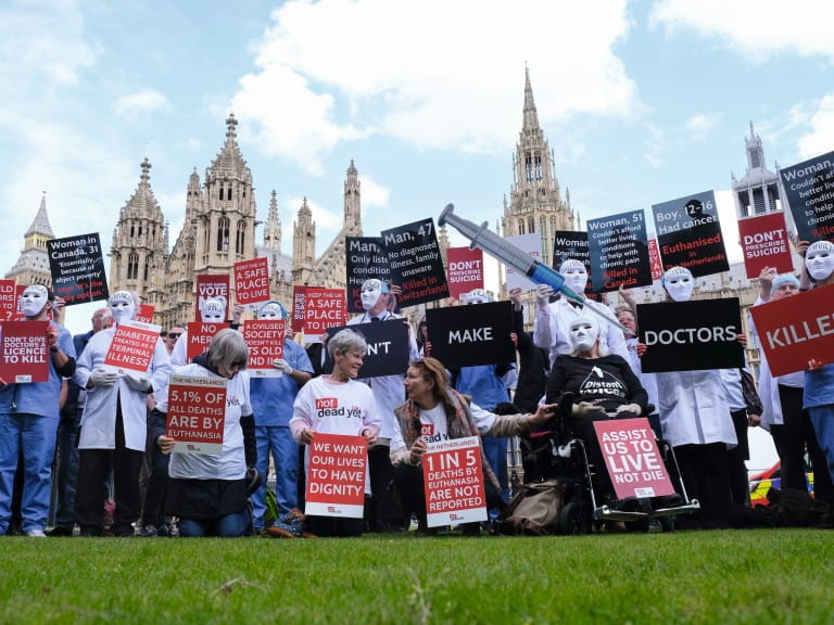 Campaigners at the Houses of Parliament protest against assisted dying | Alamy