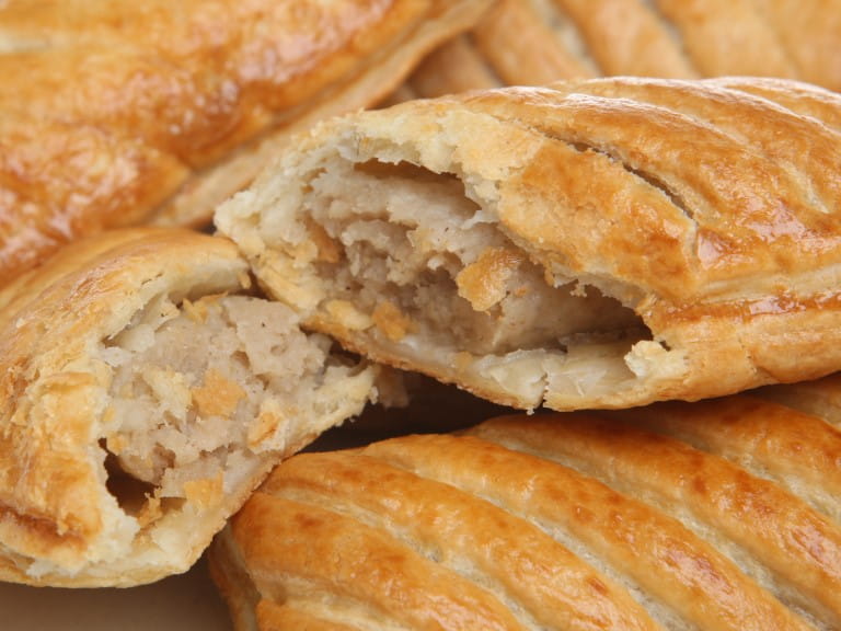 Close-up of freshly baked sausage rolls | Getty/JoeGough