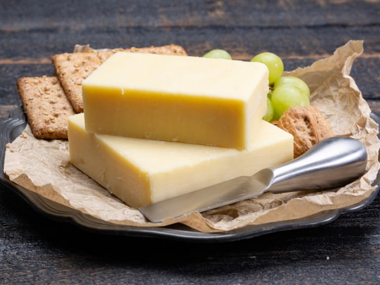 Block of aged cheddar cheese