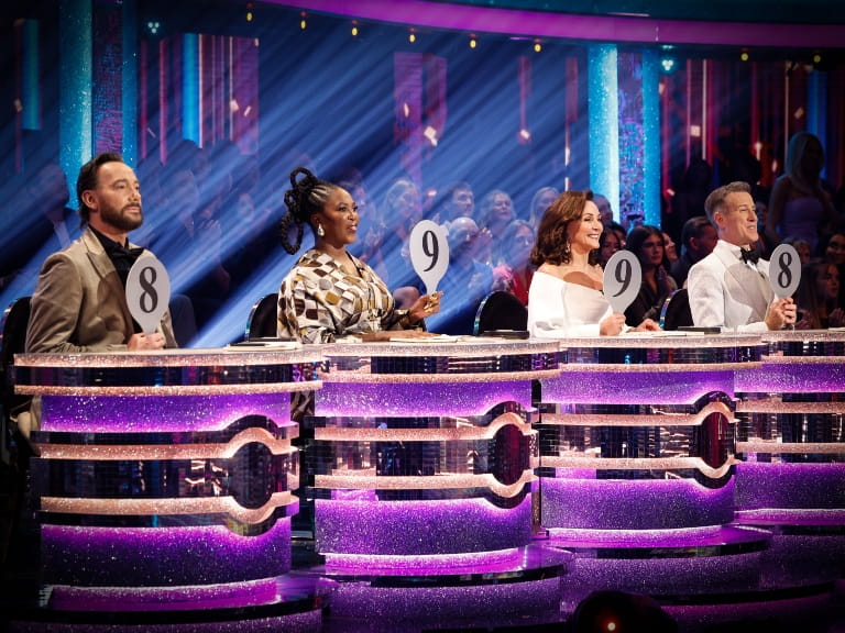 A panel of four judges holding scoring cards on BBC's Strictly Come Dancing; Craig Revel Horwood, Motsi Mabuse, Shirley Ballas and Anton Du Beke