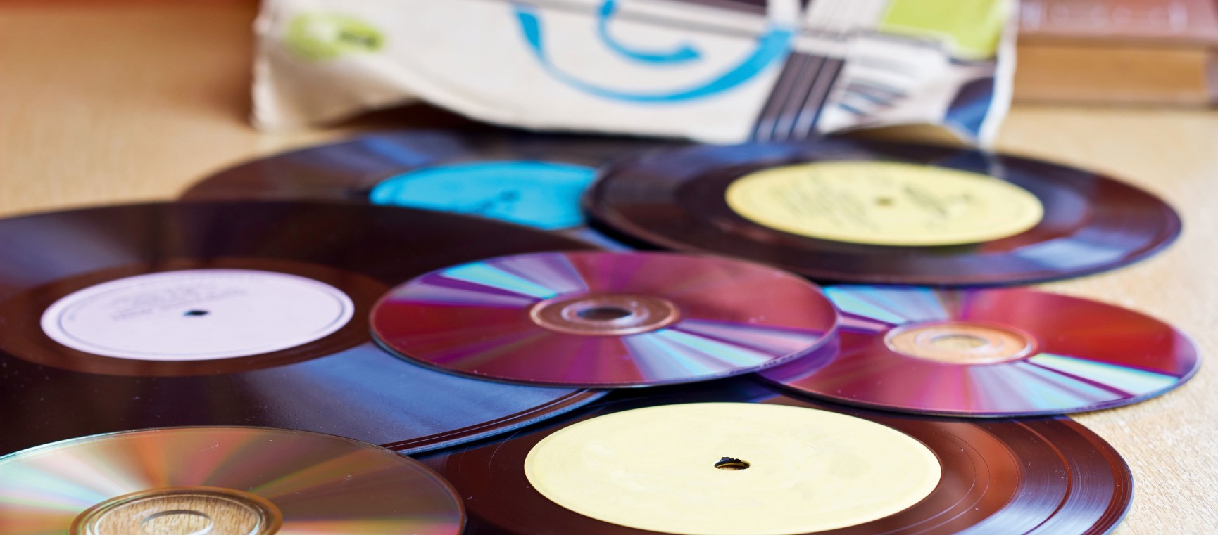 CDs and records strewn on a table