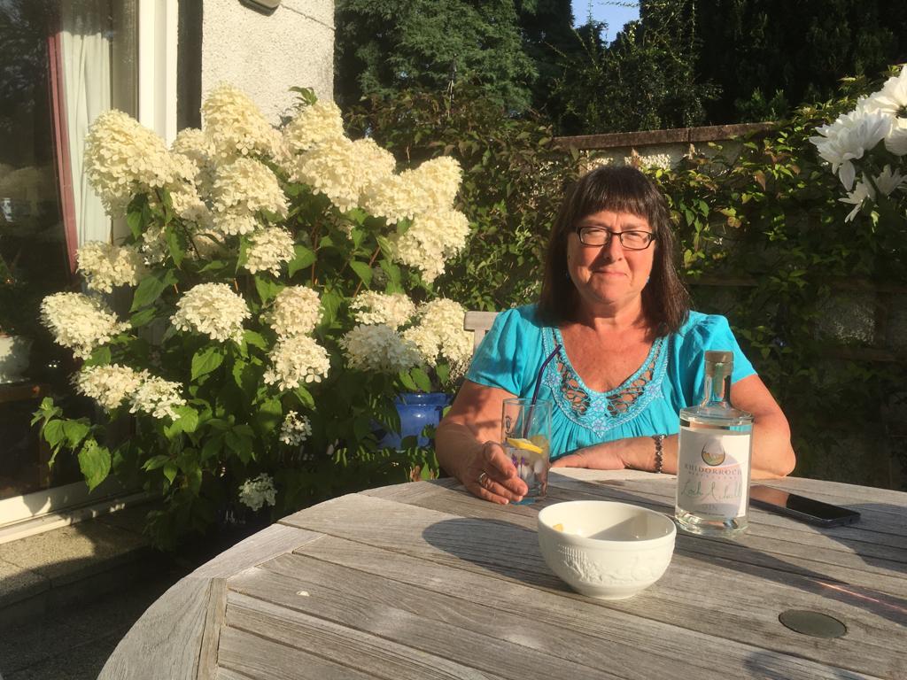 Valerie enjoying a gin and tonic outside
