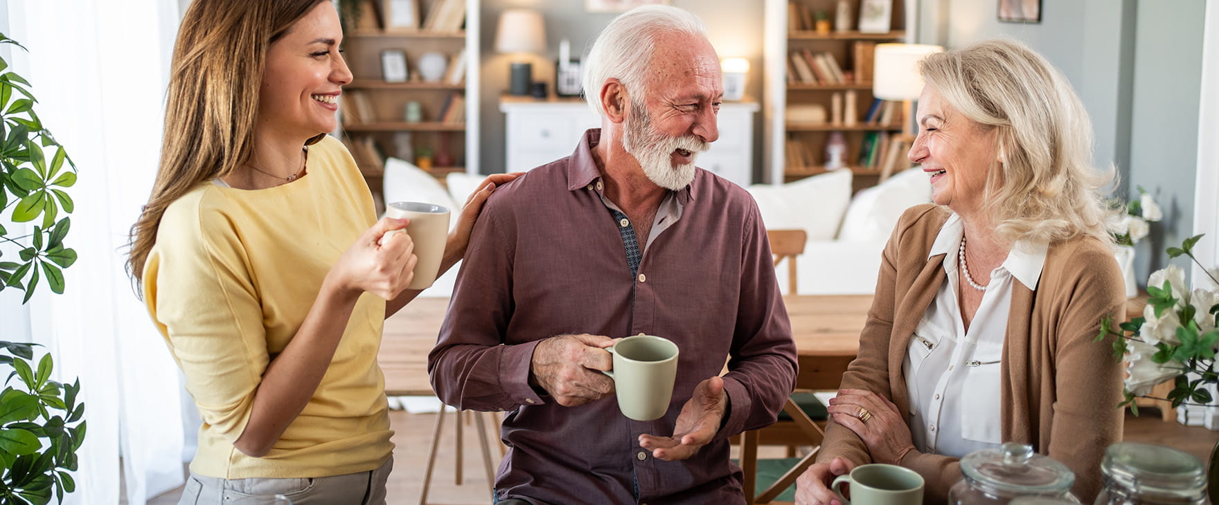 Family laughing together in the kitchen