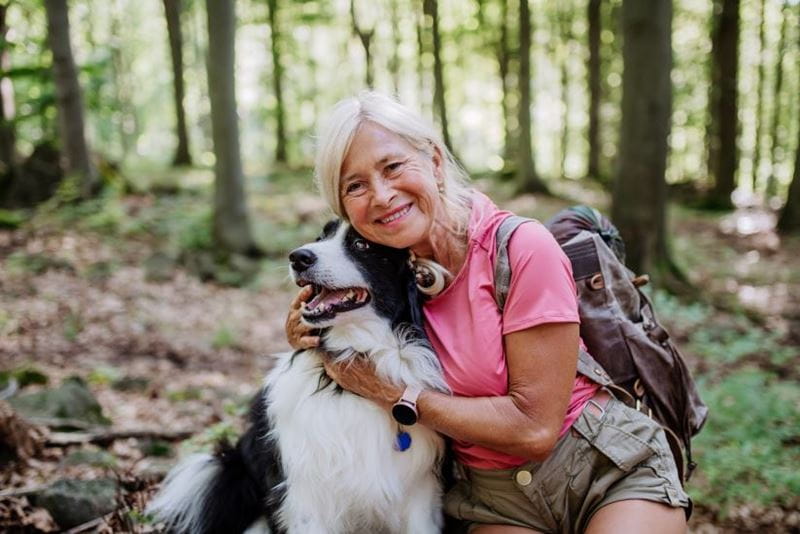 Woman hugging her dog