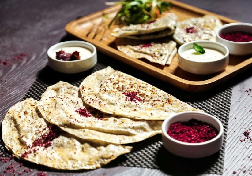 Tray of qutab flatbreads