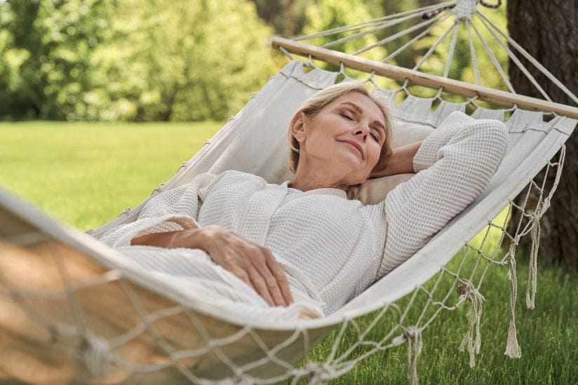 Woman asleep in a hammock