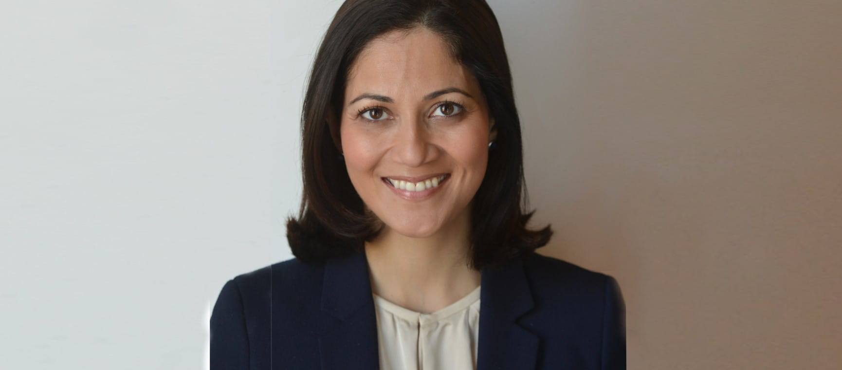 Mishal Husain smiling at the camera | BBC