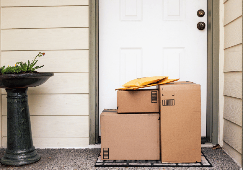 A pile of parcels left outside a front door