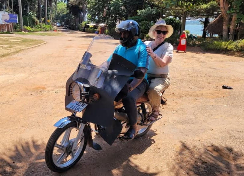 Sheila Fitzgerald on the back of a bike