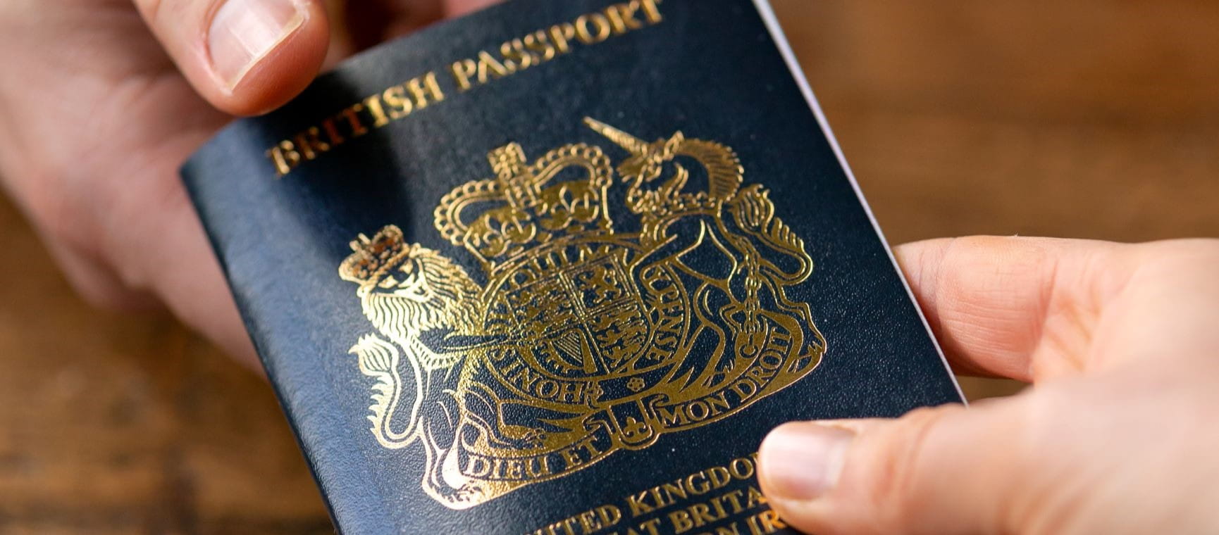 A passport being passed from person to person