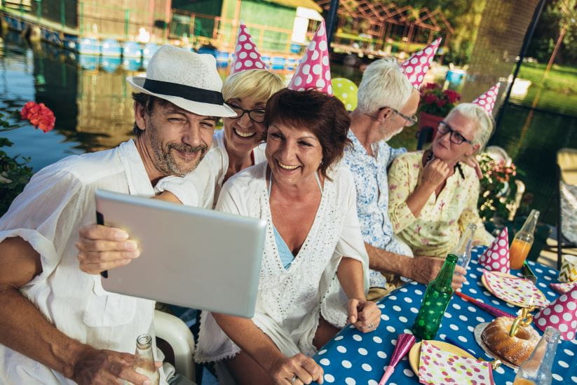 Group of people at a party taking a selfie