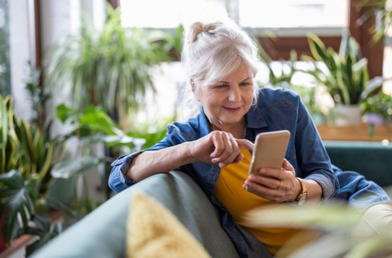Woman playing on her phone