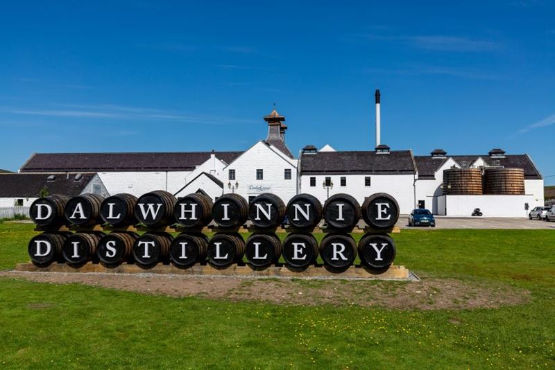 Dalwhinnie Distillery in the Cairngorms on a sunny day