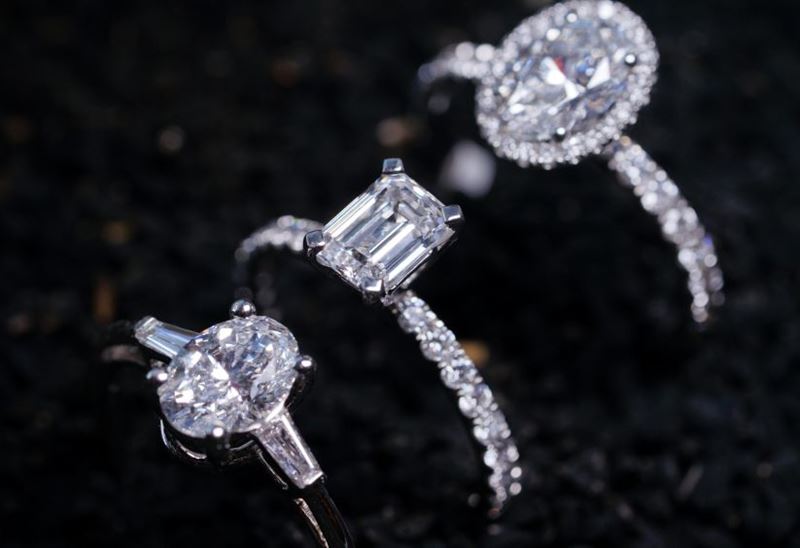 3 natural diamond rings on a black background