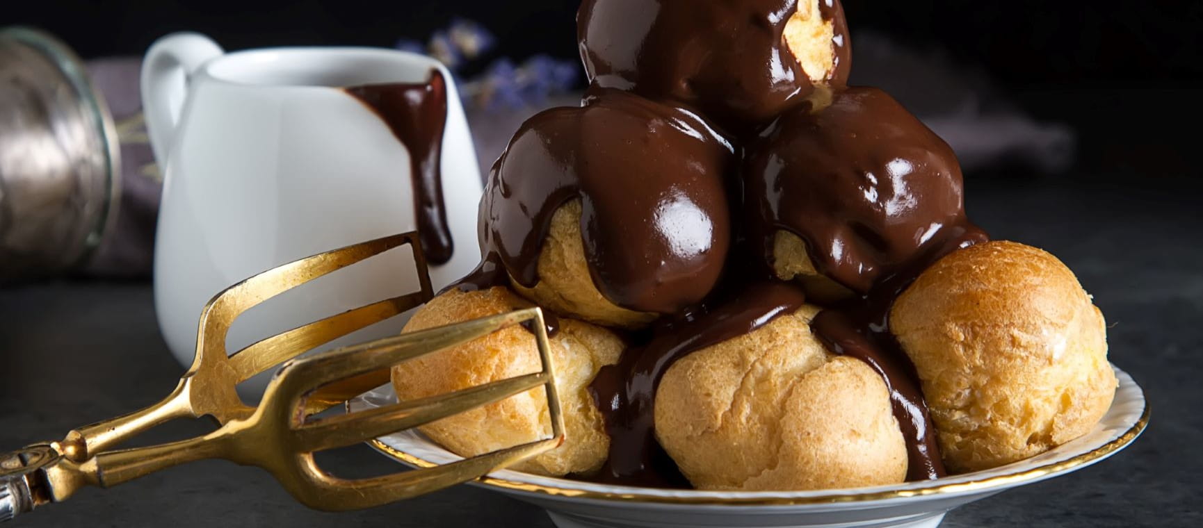 Chocolatey profiteroles on a plate 