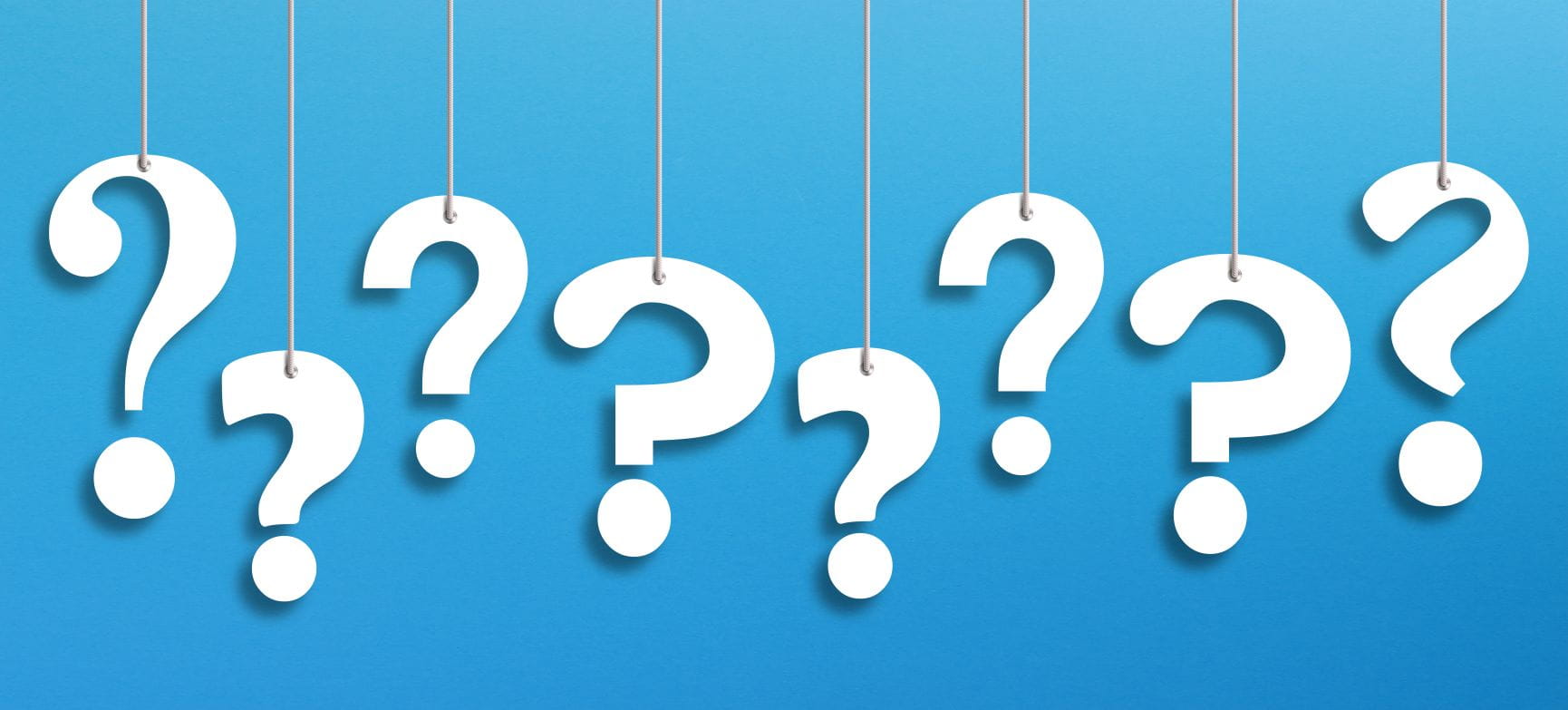white question marks on a blue background