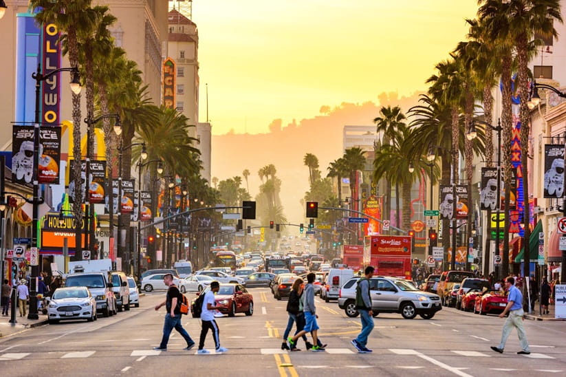 A crossing on Hollywood Boulevard as the sun sets