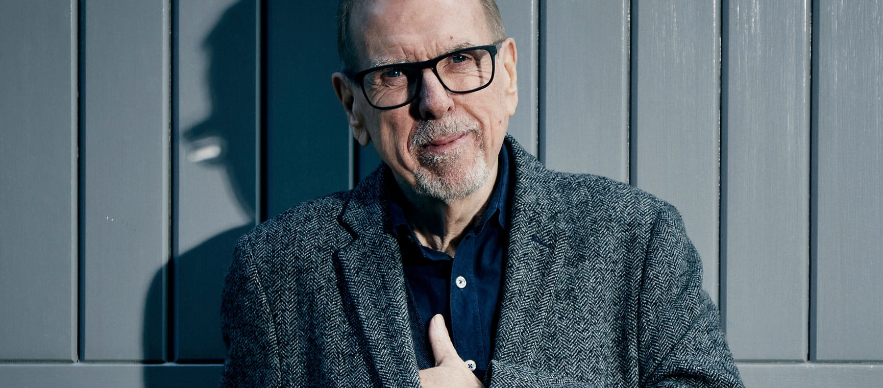Timothy Spall up to date photo of him against a wall