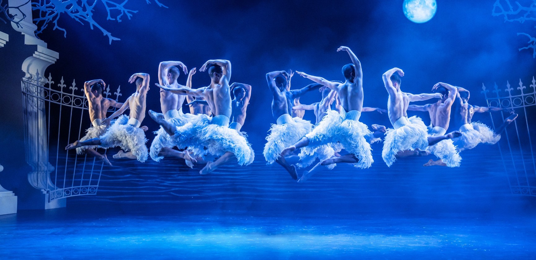 Dancers in white feather trousers in Swan Lake