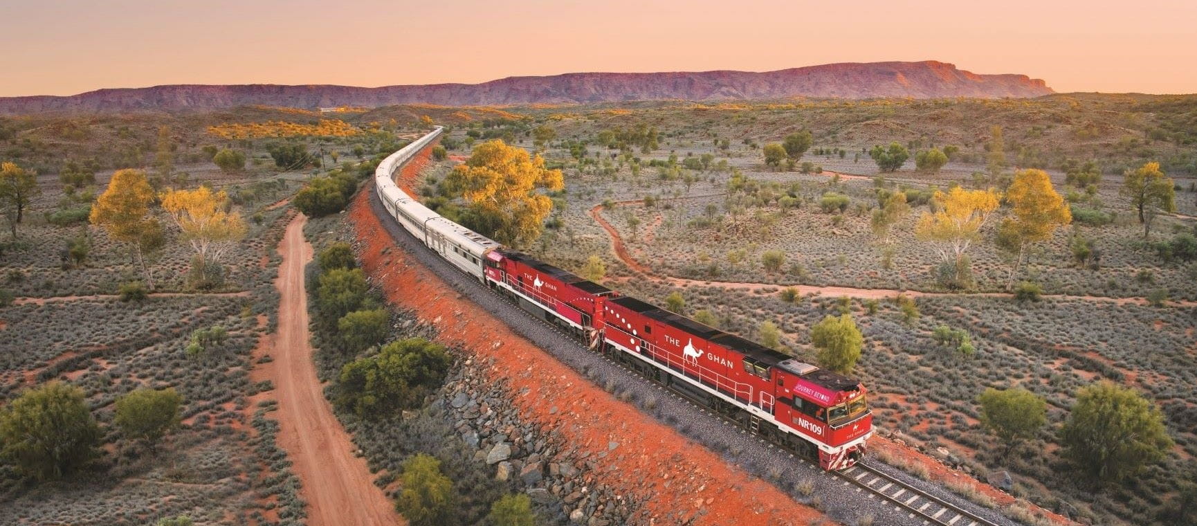 The Ghan train going through the Macdonnell ranges