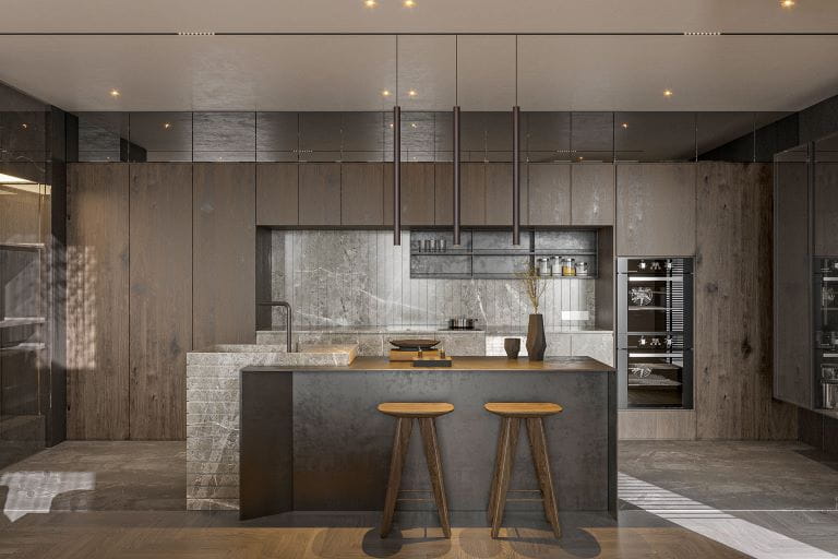 a modern kitchen with breakfast bar beneath free standing stairs
