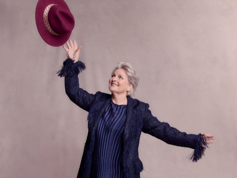 Brenda Blethyn throwing a hat in the air