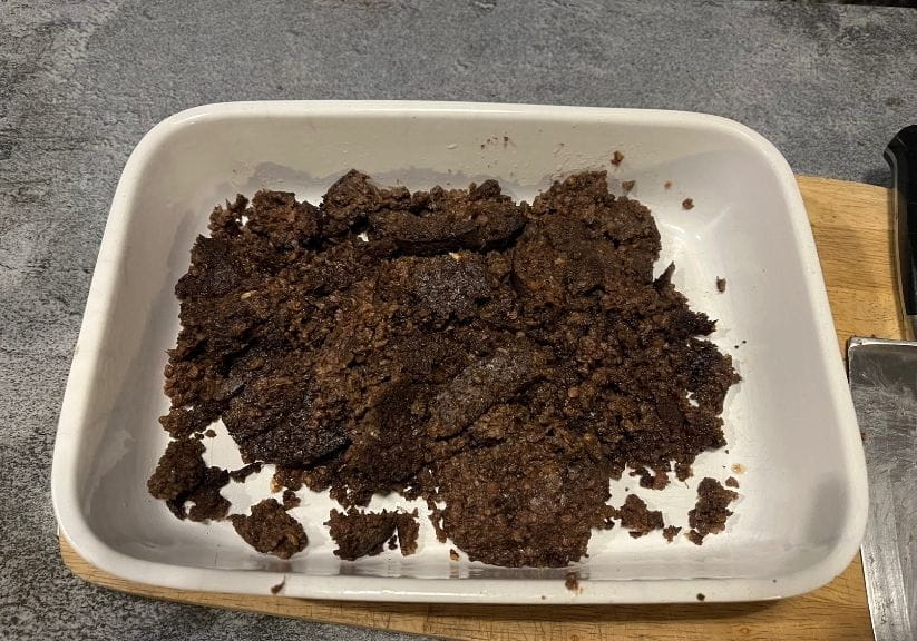 a white dish containing gluten free haggis