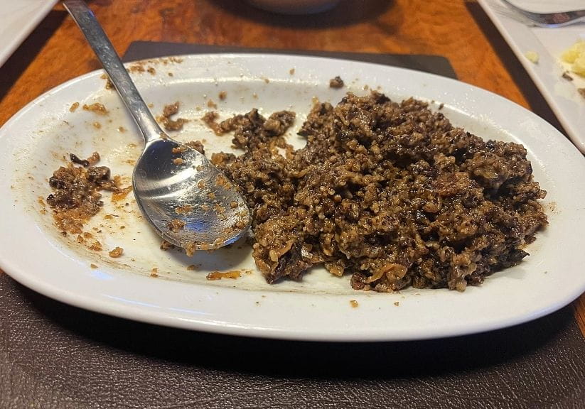 a white dish of grant premium haggis