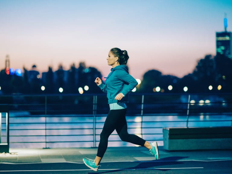 A woman going for a run in the evening
