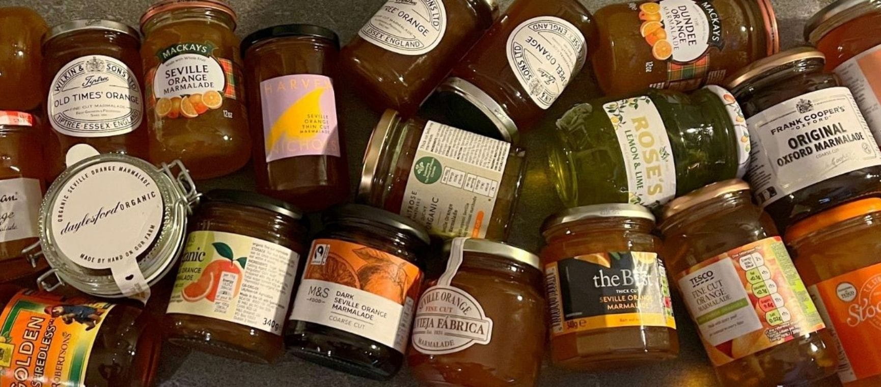 dozens of jars of different brands of marmalade
