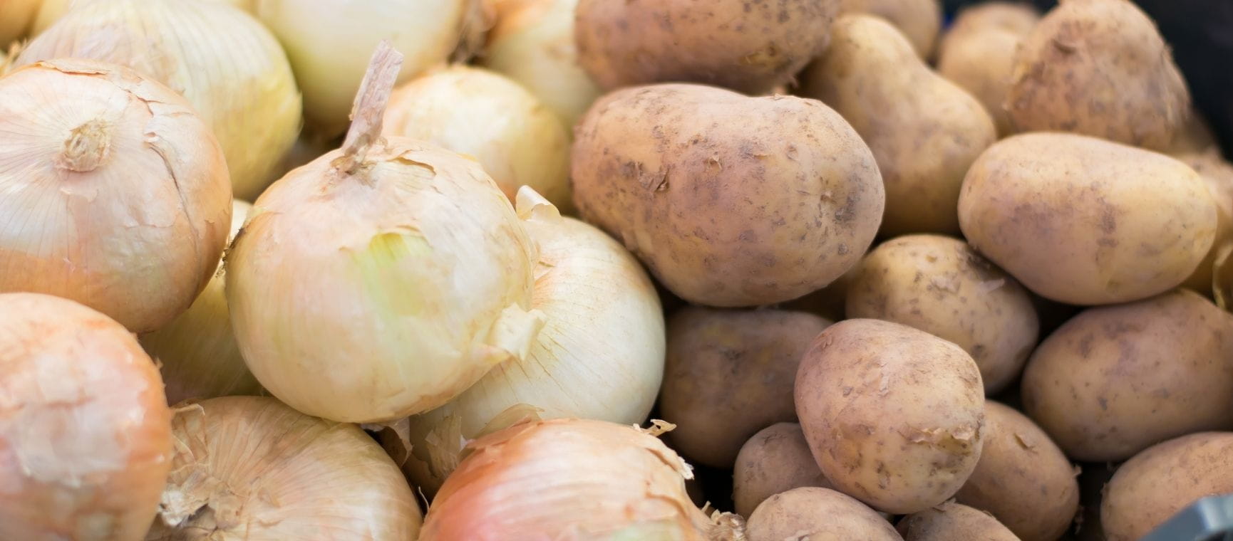 potatoes and onions being stored together
