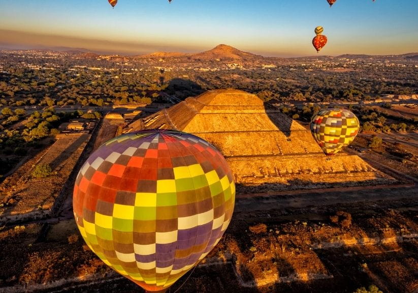 Balloons flying over Teotihuacan, Mexico City, at sunrise