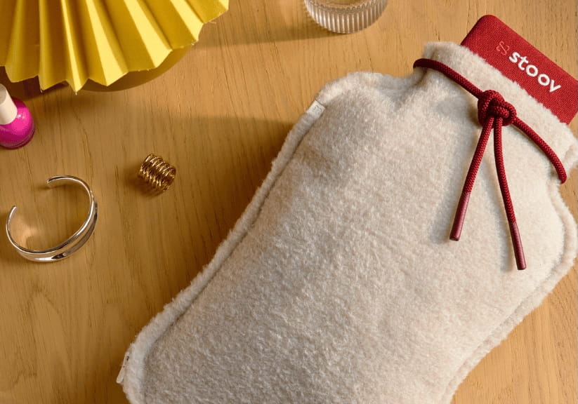 Homey a rechargeable heated bottle on a bedside table