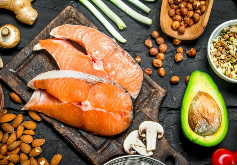 a selection of food rich in omega 3 on a black background
