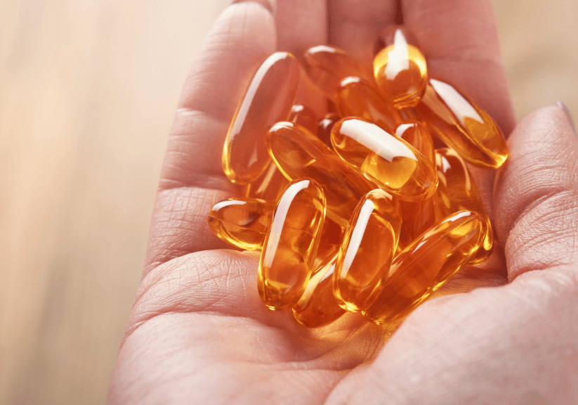 omega 3 oil capsules being held in a hand