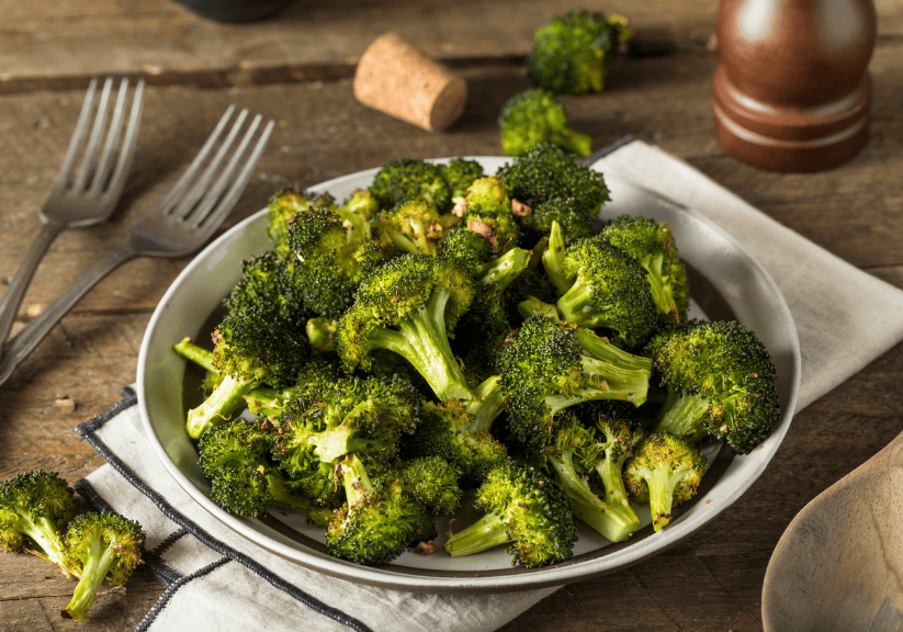 roasted broccolli in a white dish
