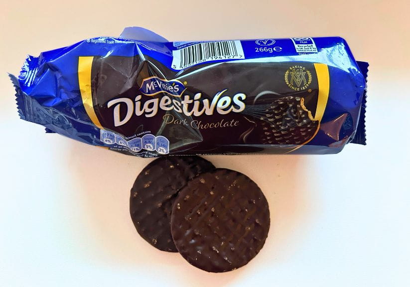 A packet of McVitie's Dark Chocolate digestives shot against a white background