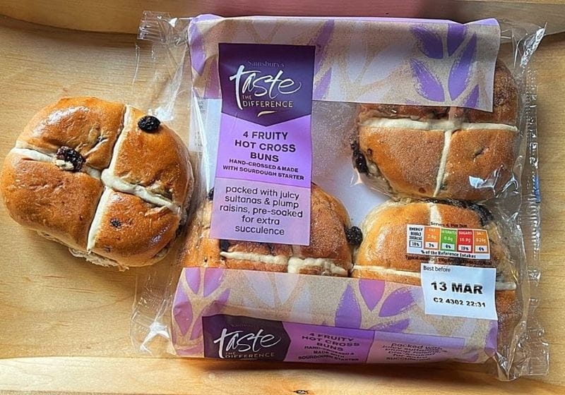 A packet of Sainsburys hot cross buns