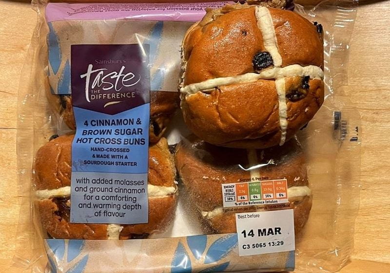 A packet of Sainsbury's salted caramel hot cross buns