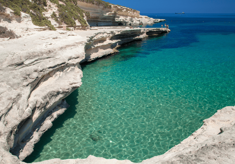 St Peters Pool Malta with crystal clear waters on a sunny day